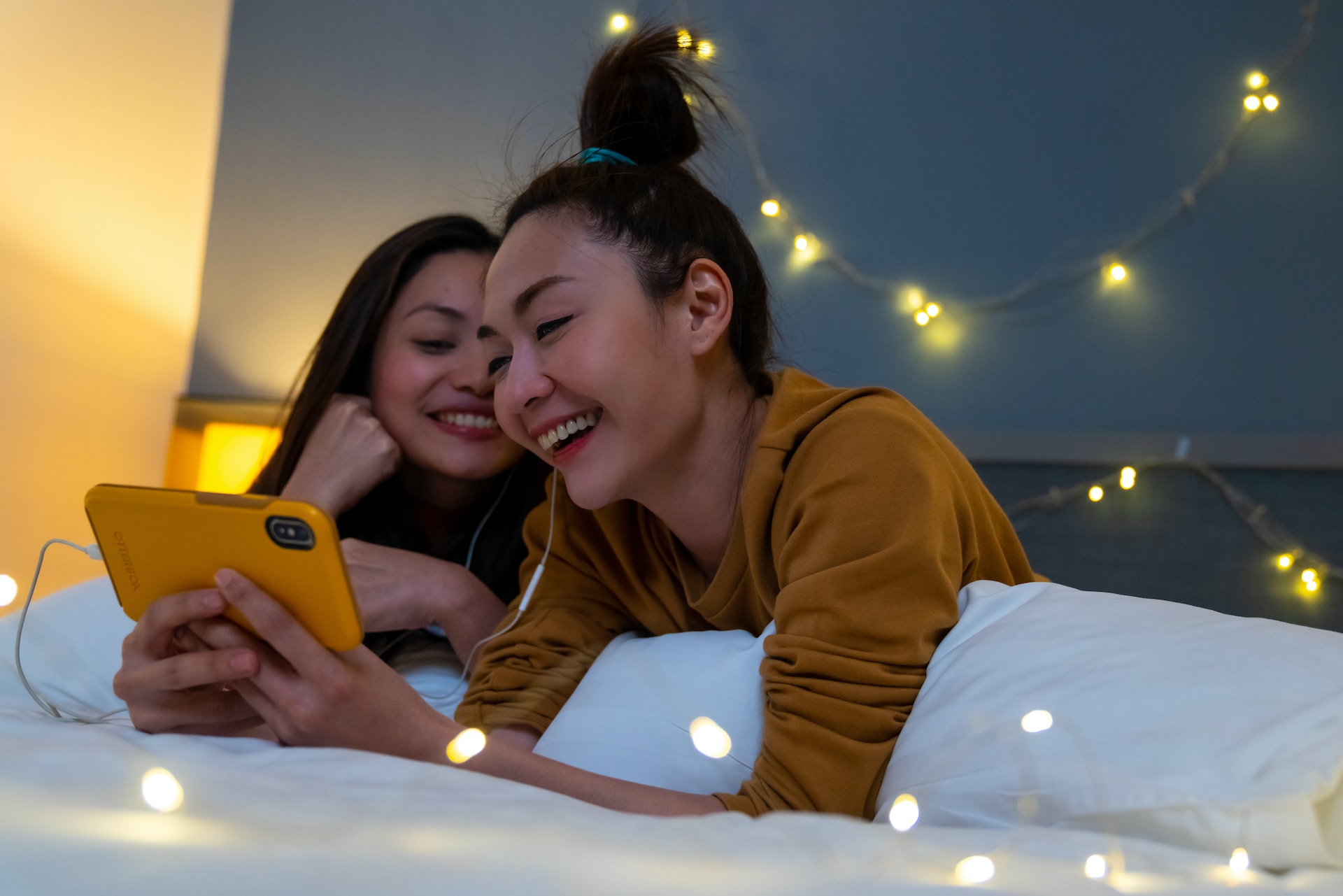 women watching a video on a smartphone